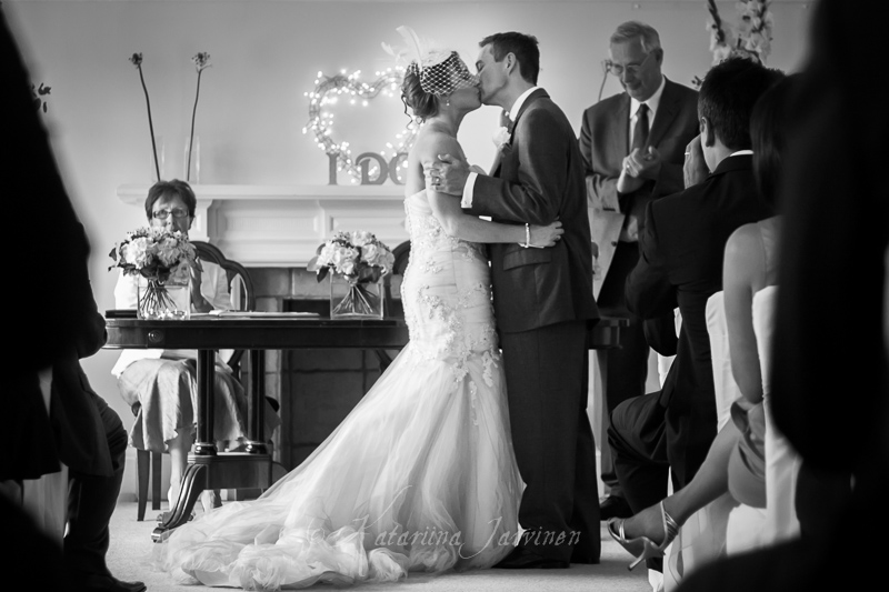 _MG_3389-2 wedding couple first kiss, with alien registrar in the background